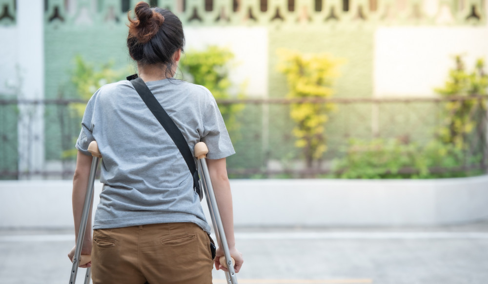 Woman using crutches